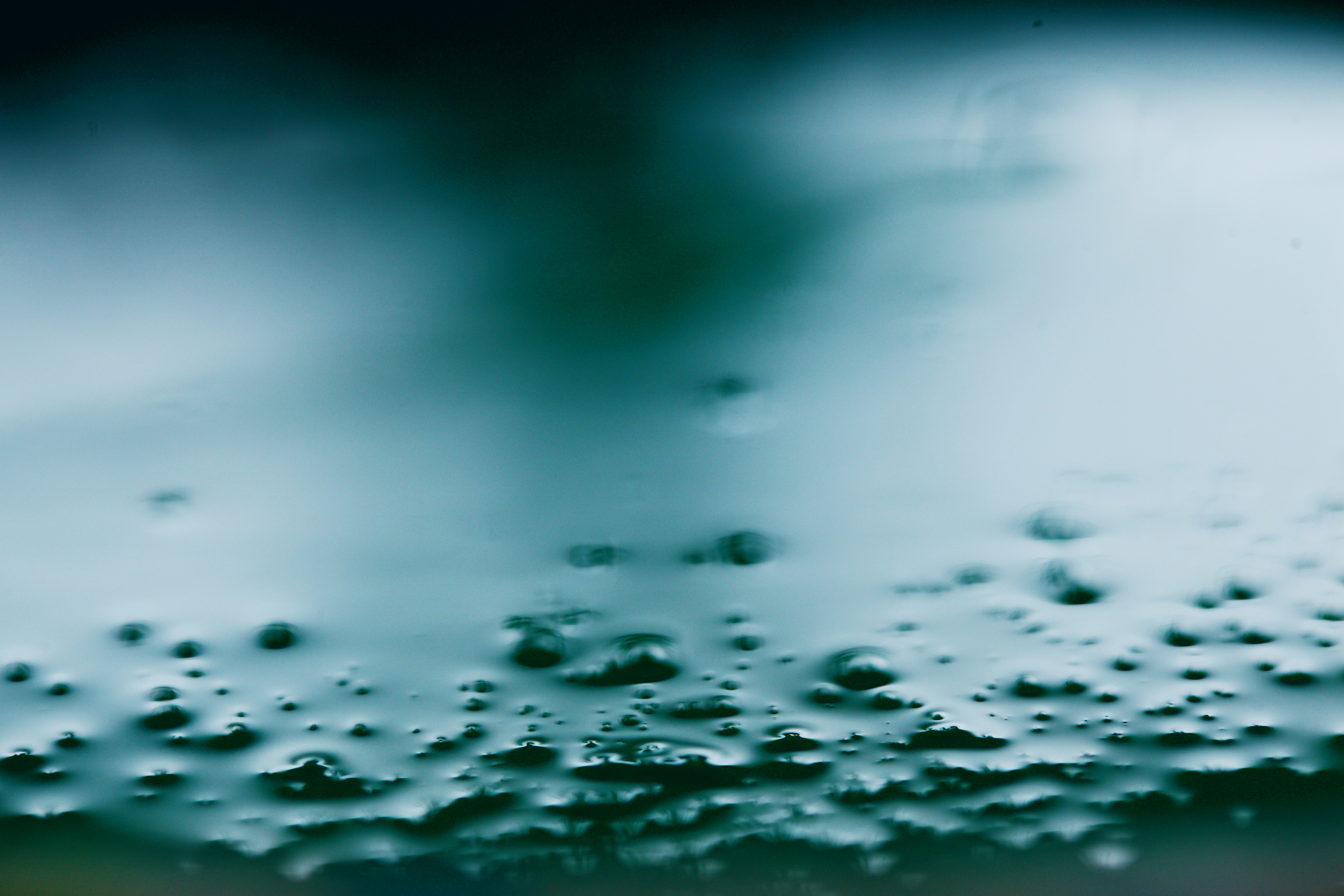 water droplets on green surface